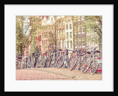 Cycles parked by the street by Assaf Frank